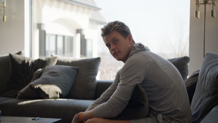 Bengals quarterback Joe Burrow talks to a Netflix producer during an episode in the new season of "Quarterback."