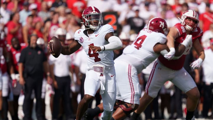 Sep 14, 2024; Madison, Wisconsin, USA; Alabama Crimson Tide quarterback Jalen Milroe (4) throws a pass during the first quarter against the Wisconsin Badgers at Camp Randall Stadium. 