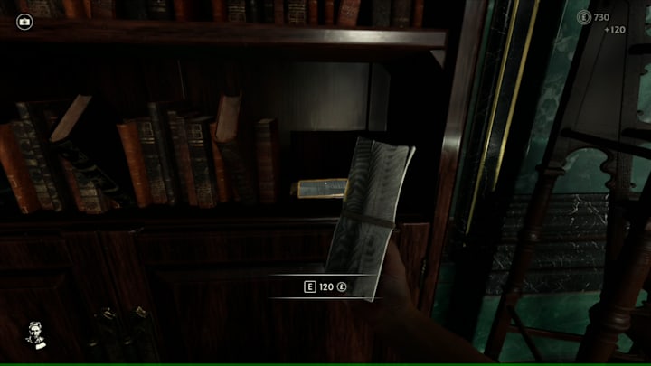 A secret compartment on a bookshelf revealing money and a note.