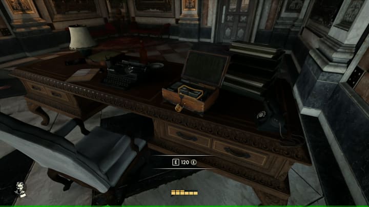 An open lockbox on an officer's table, revealing money inside.