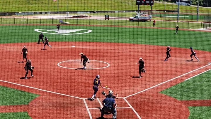 Tabithah Taylor of Bryan drops down a bunt in the 2024 Division II state semifinals against Logan Elm to bring in the game-winning run. 