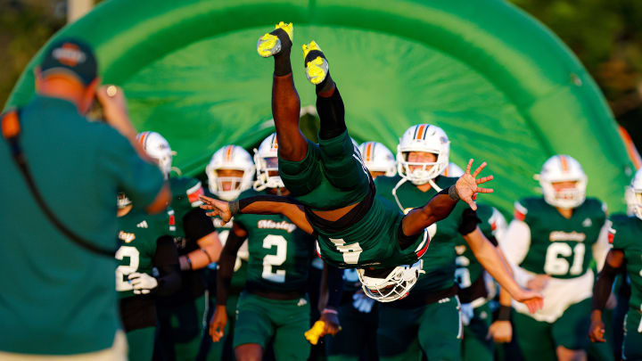 Mosley's (Fla.) Samuel Chisolm does a backflip while leading his teammates onto the field.