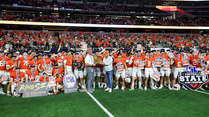 Celina coaches and players pose for a team shot following their victory in the Texas 4A Division 1 state championship game at AT&T Stadium.