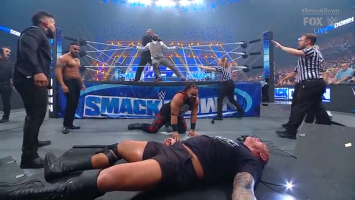 The Bloodline puts Randy Orton through a table while Cody Rhodes is forced to watch at the end of WWE Friday Night SmackDown.