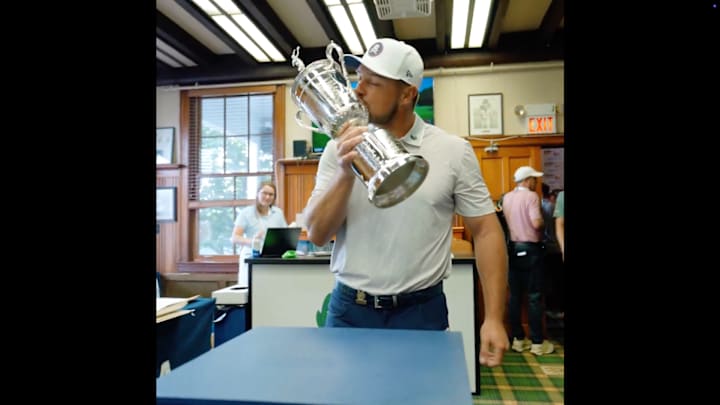 Bryson DeChambeau returns the U.S. Open trophy. Bryson DeChambeau returns the U.S. Open trophy.