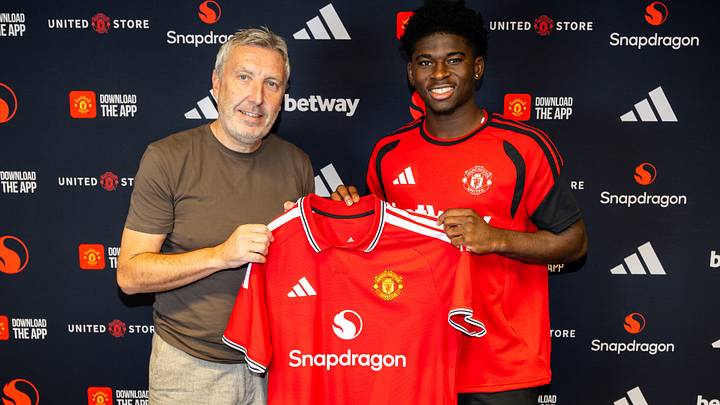 Carlos Baleba has got his hands on a Man Utd shirt. Carlos Baleba has got his hands on a Man Utd shirt.