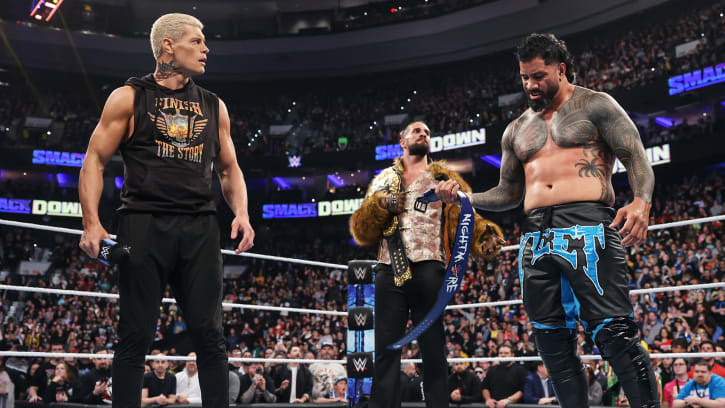 Cody Rhodes, Seth Rollins, and Jey Uso stand tall at the end of WWE Friday Night SmackDown.