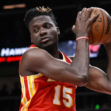 Dec 13, 2021; Atlanta, Georgia, USA; Atlanta Hawks center Clint Capela (15) gets a rebound against the Houston Rockets during the first half at State Farm Arena. Mandatory Credit: Dale Zanine-Imagn Images