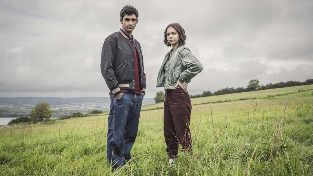 A Good Girl's Guide to Murder. Zain Iqbal as Ravi Singh and Emma Myers as Pip Fitz-Amobi in A Good Girl's Guide to Murder. Cr. Courtesy of Sally Mais/Netflix © 2024