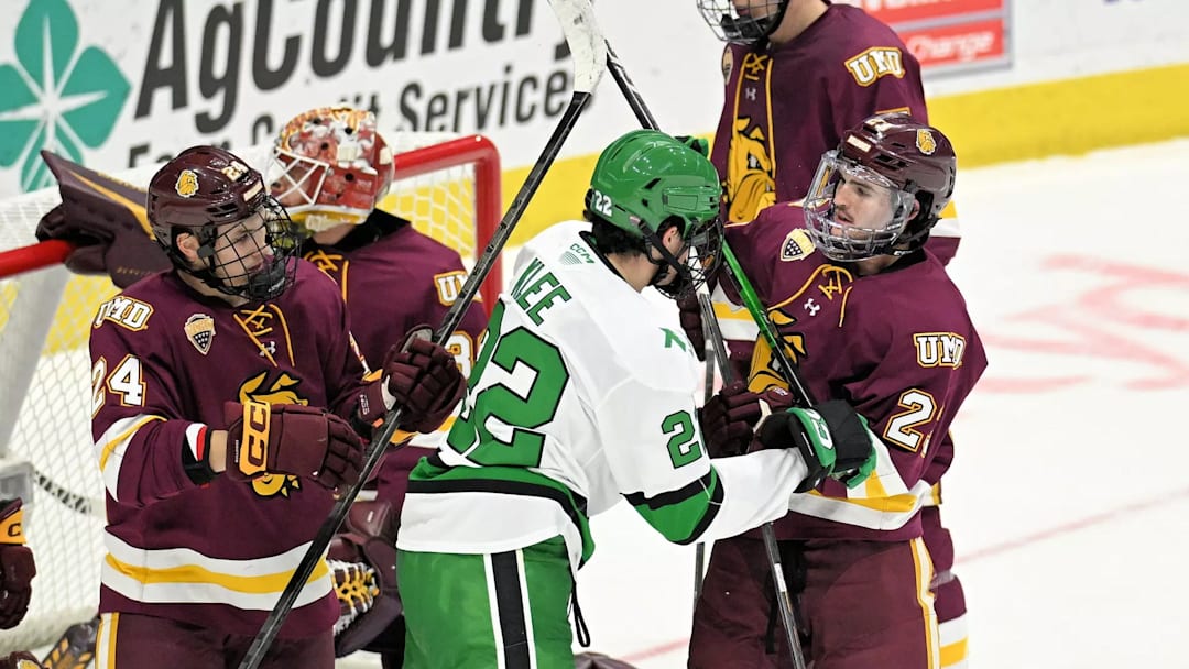 Minnesota Duluth and North Dakota players exchange words.