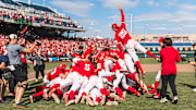Nebraska players celebrate with a dogpile after winning the 2025 Big Ten Baseball Tournament championship over UCLA.