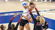 Nebraska middle blocker Rebekah Allick fires a kill through the Stanford defense during the first set of the AVCA First Serve vs. Stanford.