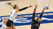 Nebraska middle blocker Andi Jackson spikes the ball and scores a point for the Huskers during the first set of the AVCA First Serve.