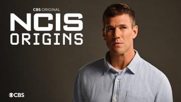 NCIS: ORIGINS follows a young Leroy Jethro Gibbs (Austin Stowell) in 1991, years prior to the events of NCIS, and is narrated by Mark Harmon. In the series, Gibbs starts his career as a newly minted special agent at the fledgling NCIS Camp Pendleton office where he forges his place on a gritty, ragtag team led by NCIS legend Mike Franks (Kyle Schmid). NCIS: ORIGINS stars Austin Stowell as young Leroy Jethro Gibbs, Kyle Schmid as Mike Franks, Mariel Molino as Special Agent Lala Dominguez, Tyla