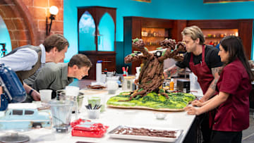 Hosts James and Oliver Phelps with Contestants Riccardo Meniccuci and Hemu Basu, as seen on Harry Potter: Wizards of Baking, Season 1.