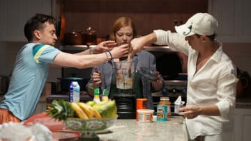 (Left to right) Kieran Culkin, Sarah Snook, and Jeremy Strong making a meal fit for a king in HBO's 'Succession.'