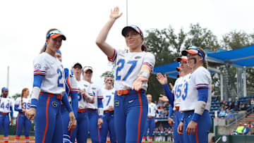 Kendra Falby (27) performs the signature Gator chop in front of home fans.