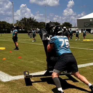 Jacksonville Jaguars offensive guard Ezra Cleveland pushes a blocking sled during a training camp practice on Aug. 12 at the Miller Electric Center.