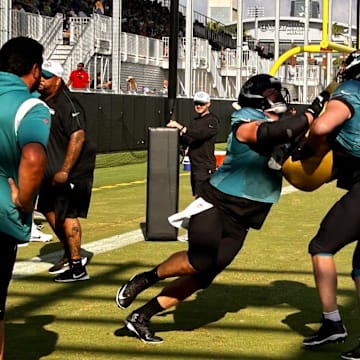 Jacksonville Jaguars offensive line coach Phil Rauscher watches center Mitch Morse (left) and guard Ezra Cleveland go through a drill during training camp on Aug. 2 at the Miller Electric Center.