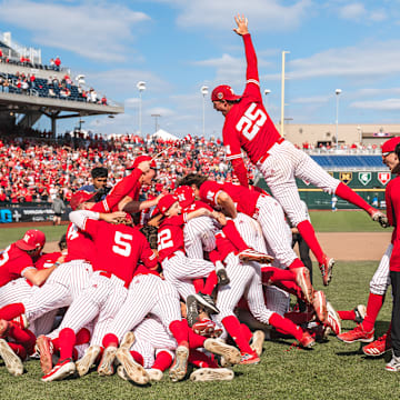 Nebraska players celebrate with a dogpile after winning the 2025 Big Ten Baseball Tournament championship over UCLA.