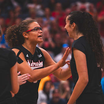 Nebraska middle blocker Rebekah Allick and opposite hitter Virginia Adriano celebrate during a five-set win over No. 7 Kentucky in Nashville.