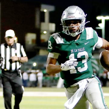 De La Salle quarterback Toa Faavae scores one of his two rushing touchdowns on Friday night.