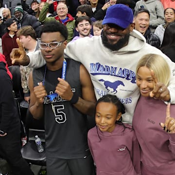 LeBron James, his wife and daughter, pose with son Bryce after he and Sierra Canyon teammates won the California (CIF) State Division 1 boys basketball championship Friday night at the Golden 1 Center in Sacramento.