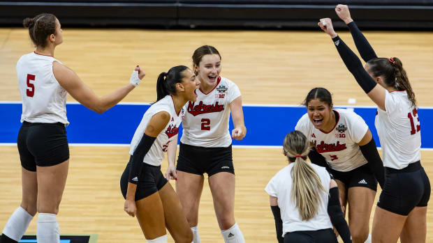 Nebraska volleyball celebrates a point in the National Semifinal against Pitt.