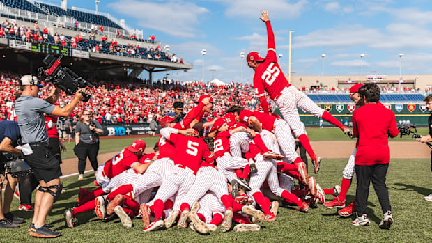 Nebraska players celebrate with a dogpile after winning the 2025 Big Ten Baseball Tournament championship over UCLA.