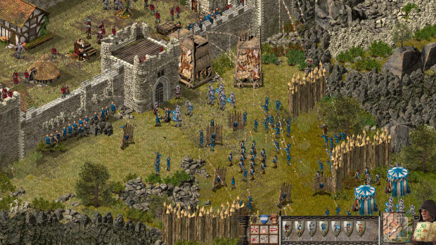 Stronghold: Definitive Edition screenshot of a castle being attacked.