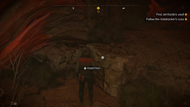 This button is hidden on the East side of the cave.