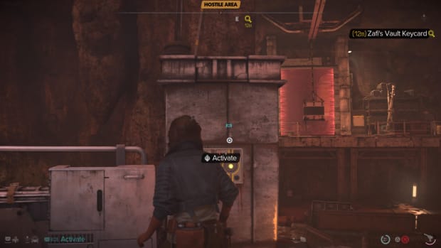 Star Wars Outlaws screenshot of Kay looking at a button, with a metal box hanging from a rail in the distance.