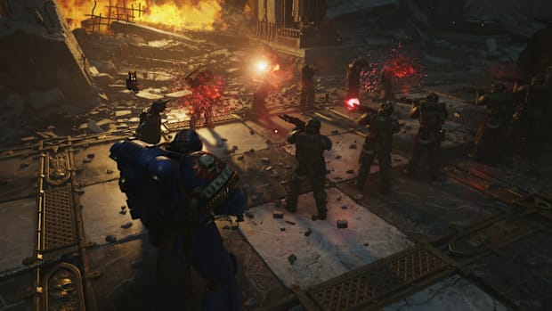 Warhammer 40,000: Space Marine 2 screenshot showing deserters being executed by a firing squad.