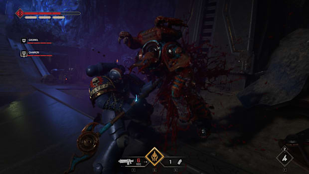 Warhammer 40,000: Space Marine 2 screenshot of a Space Marine executing a Chaos Space Marine.