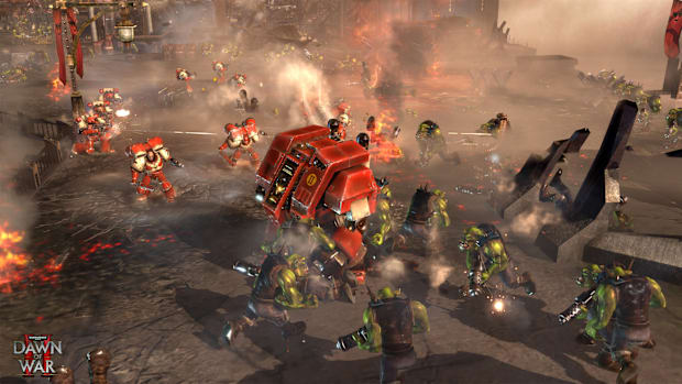 Warhammer 40,000: Dawn of War 2 screenshot showing Orks fight Space Marines.