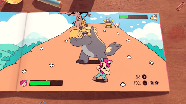 Screenshot from the The Plucky Squire showing a boss fight against a bear.