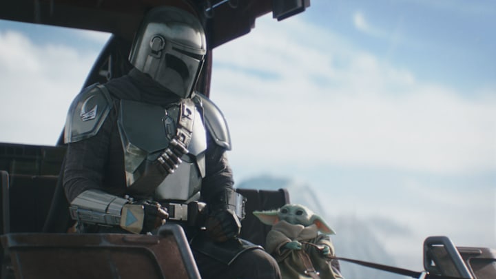(L-R) Mandalorian (Pedro Pascal) and Grogu in Lucasfilm's THE MANDALORIAN AND GROGU.