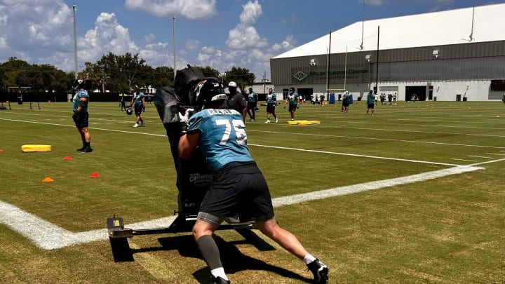 Jacksonville Jaguars offensive guard Ezra Cleveland pushes a blocking sled during a training camp practice on Aug. 12 at the Miller Electric Center.