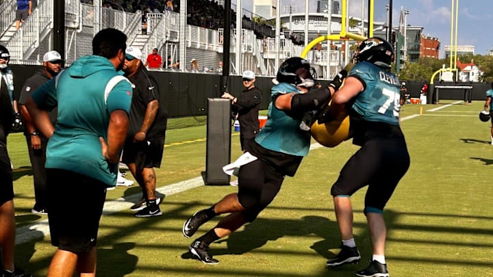 Jacksonville Jaguars offensive line coach Phil Rauscher watches center Mitch Morse (left) and guard Ezra Cleveland go through a drill during training camp on Aug. 2 at the Miller Electric Center.