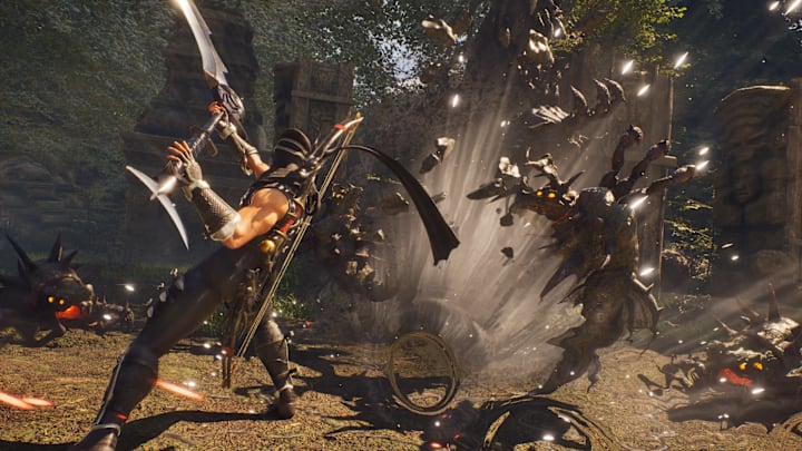 Ryu slashes demons up with a scythe in Ninja Gaiden 2 Black.
