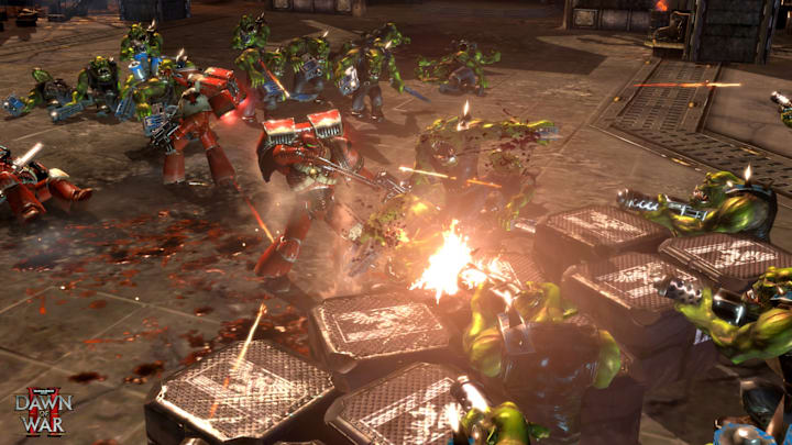 Warhammer 40,000: Dawn of War 2 screenshot of Blood Ravens fighting Orks.