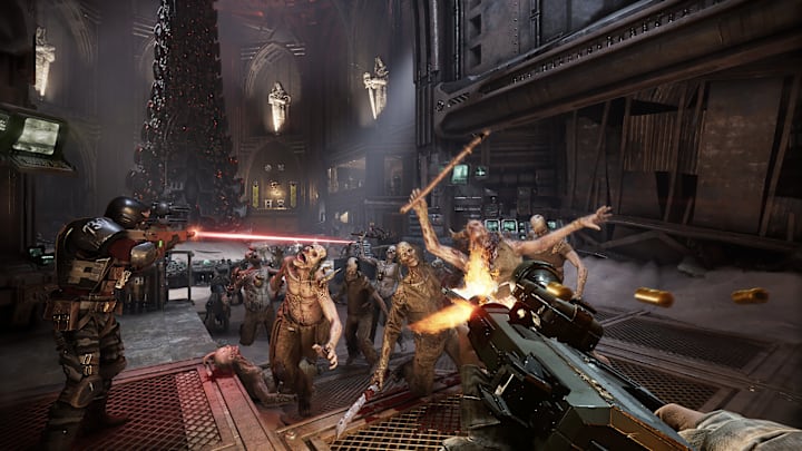 Warhammer 40,000: Darktide screenshot of someone shooting a gun at a horde of zombie-like creatures.