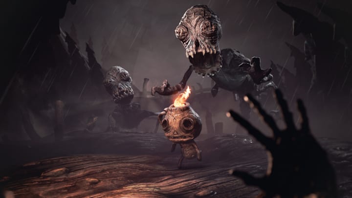 Strange clay creatures reaching out for a smaller creature with fire coming out the top of their head.