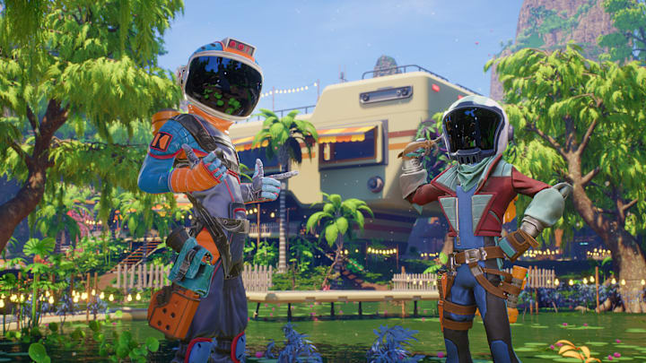 Two astronauts in a swamp with a mobile house in the background.