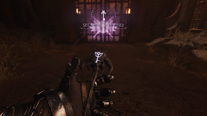 The Doom Slayer holding a Purple Key in front of a big gate.