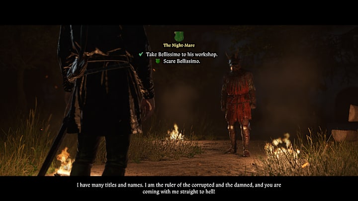 Henry posing as the devil, standing among lit torches