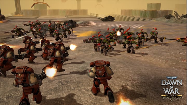 Warhammer 40,000: Dawn of War screenshot of Space Marines fighting Orks.