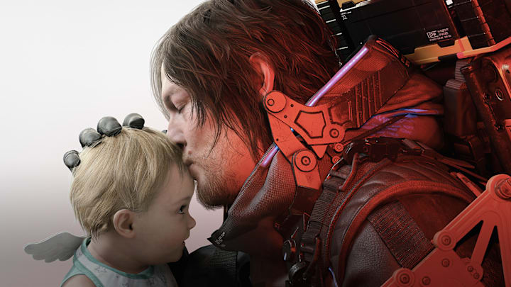 Sam Bridges kissing a child on the forehead.