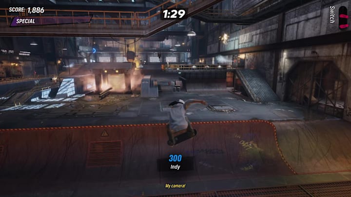 A player in Tony Hawk's Pro Skater 3+4 indying over a halfpipe in the Foundry level.