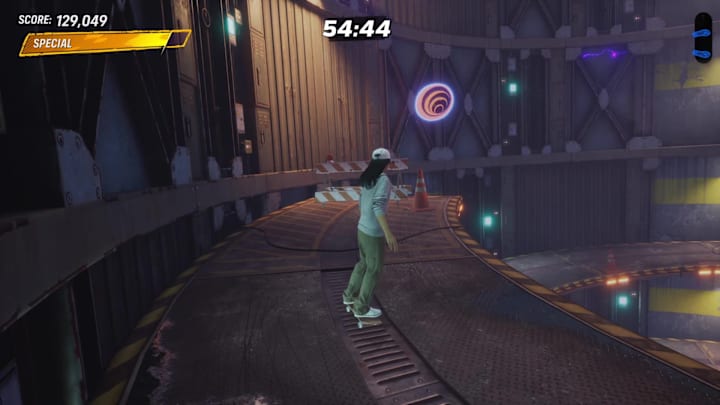 A floating Iron Galaxy icon atop a twisted spiral ramp in Tony Hawk's Pro Skater 3+4's Foundry level.
